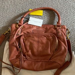 Liebeskind crossbody with adjustable straps.